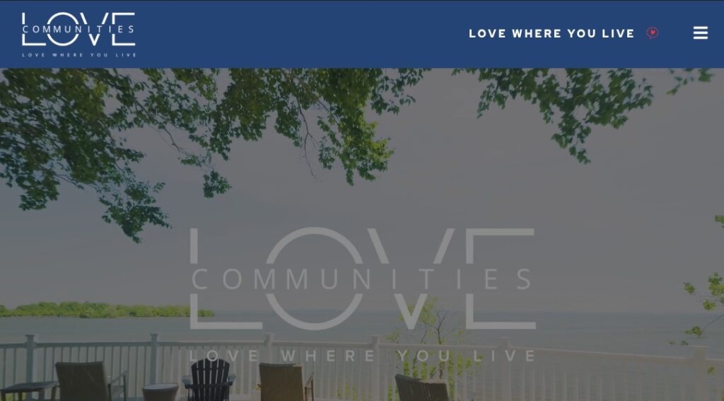 A snapshot of the livelove.com website, showing a property's waterfront deck with chairs and the Love Communities logo.